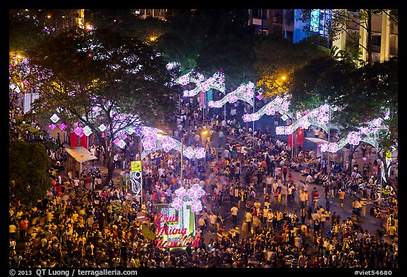 Le Loi boulevard with decorations and crowds from above. Ho Chi Minh City, Vietnam (color)