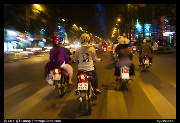 Motorbike riders at night from riders perspective. Ho Chi Minh City, Vietnam (color)