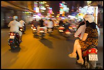 Riders view of motorcycle traffic blurred by speed. Ho Chi Minh City, Vietnam (color)