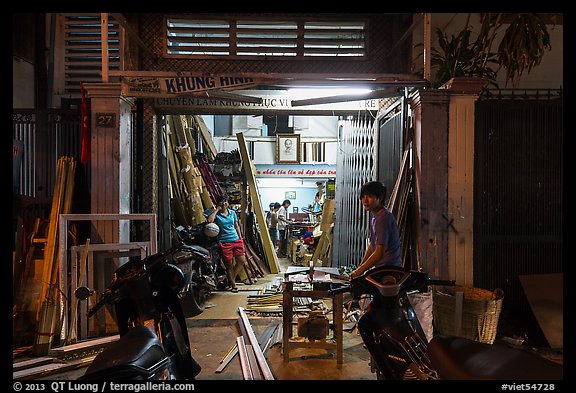 Frame shop at night. Ho Chi Minh City, Vietnam (color)