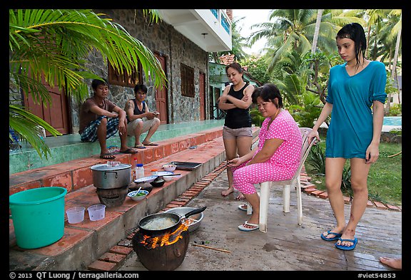Vacationers frying fish in resort. Mui Ne, Vietnam (color)