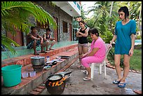 Vacationers frying fish in resort. Mui Ne, Vietnam ( color)