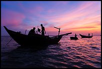 Fishermen on boats at sunset. Mui Ne, Vietnam (color)