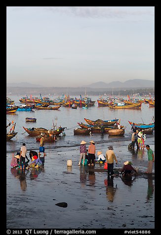 Miror-like beach and fishing boats, early morning. Mui Ne, Vietnam