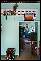 House interior with altars and picture. Mui Ne, Vietnam (color)