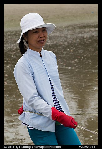 Fisherwoman pulling net line. Mui Ne, Vietnam (color)