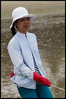 Fisherwoman pulling net line. Mui Ne, Vietnam ( color)