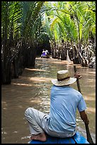 Padding in mangrove-lined narrow waterway, Phoenix Island. My Tho, Vietnam (color)