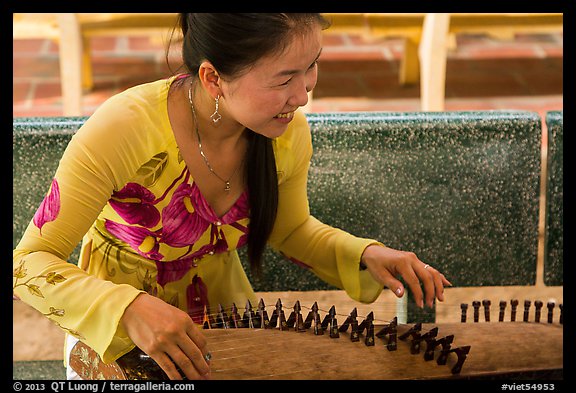 Musician with instrument. My Tho, Vietnam (color)