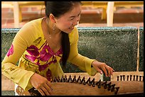 Musician with instrument. My Tho, Vietnam (color)