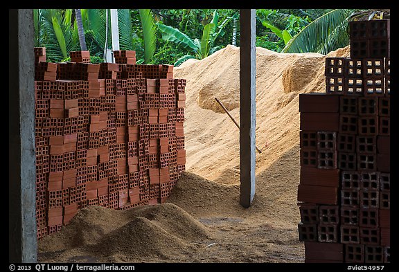 Bricks and rice hulk. Mekong Delta, Vietnam (color)