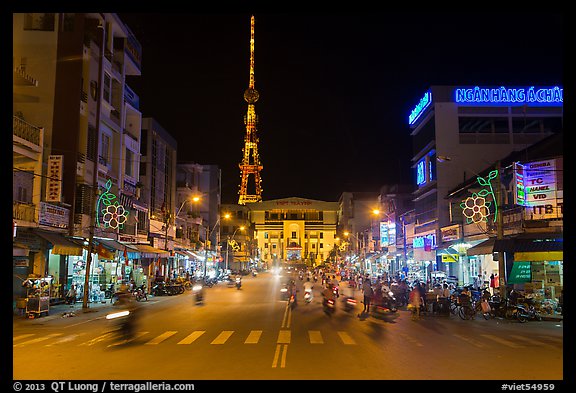 Main street and telecomunication tower at night. Tra Vinh, Vietnam (color)