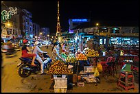 Street market and telecomunication tower at night. Tra Vinh, Vietnam ( color)