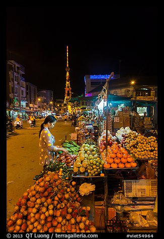 Fruit vendor on main street at night. Tra Vinh, Vietnam (color)