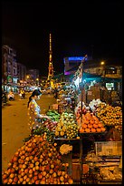 Fruit vendor on main street at night. Tra Vinh, Vietnam (color)