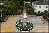 View of drying rice and statue from church tower. Tra Vinh, Vietnam ( color)