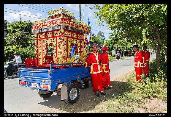 Funeral vehicle and attendants. Tra Vinh, Vietnam (color)