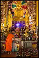 Monk lighting incense at  Ang Pagoda altar. Tra Vinh, Vietnam ( color)
