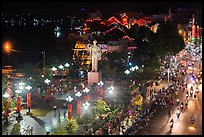 Mekong River, Ho Chi Minh statue, and street at night. Can Tho, Vietnam ( color)