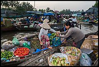 Fruit being sold from boat to boat, Phung Diem floating market. Can Tho, Vietnam (color)