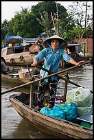 Woman using the x-shape paddles. Can Tho, Vietnam (color)