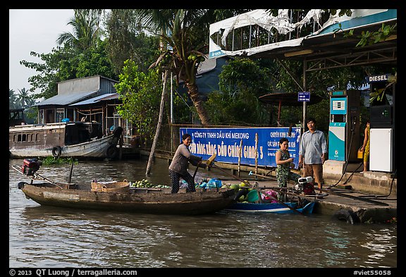 Women refilling boat tank. Can Tho, Vietnam (color)