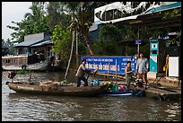 Women refilling boat tank. Can Tho, Vietnam ( color)