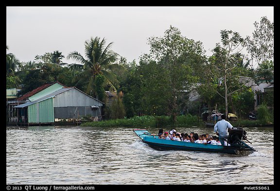 Schoolchildren on boat commute. Can Tho, Vietnam (color)