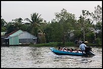 Schoolchildren on boat commute. Can Tho, Vietnam (color)