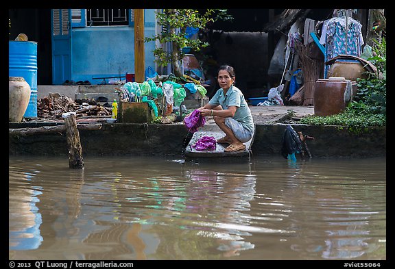 Woman laudering at the river. Can Tho, Vietnam