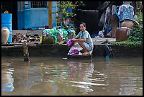 Woman laudering at the river. Can Tho, Vietnam (color)