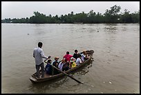 Schoolchildren crossing river on boat. Can Tho, Vietnam ( color)