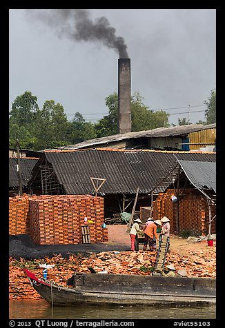 Workers moving bricks in brick factory. Sa Dec, Vietnam