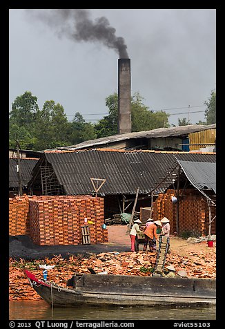 Workers moving bricks in brick factory. Sa Dec, Vietnam (color)