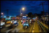 Evening traffic by the canal, District 8. Ho Chi Minh City, Vietnam