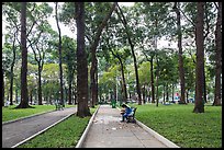 Couple looking at mobile phone, April 30 Park. Ho Chi Minh City, Vietnam