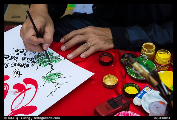 Hands drawing Tet greetings. Ho Chi Minh City, Vietnam (color)