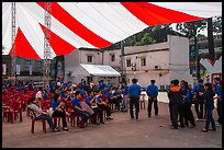 Uniformed young men and women gather for lunar new year. Ho Chi Minh City, Vietnam