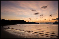 Con Son Beach with people in water before sunrise. Con Dao Islands, Vietnam ( color)