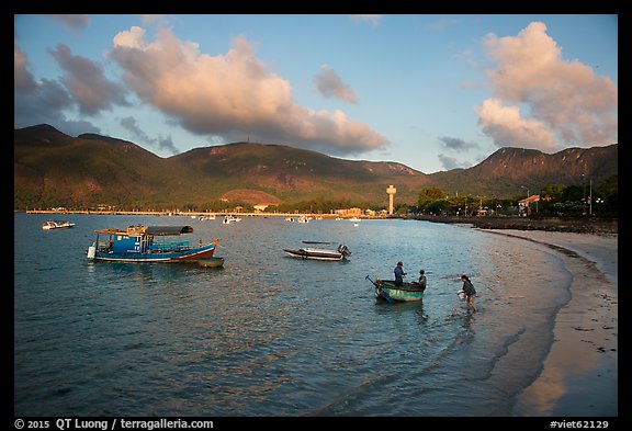 Woman collects catch from fishermen on coracle boat, Con Son. Con Dao Islands, Vietnam (color)