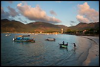 Woman collects catch from fishermen on coracle boat, Con Son. Con Dao Islands, Vietnam ( color)