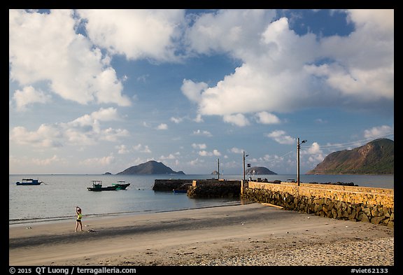 Beach with woman exercising, Con Son. Con Dao Islands, Vietnam (color)