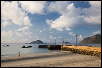 Beach with woman exercising, Con Son. Con Dao Islands, Vietnam ( color)