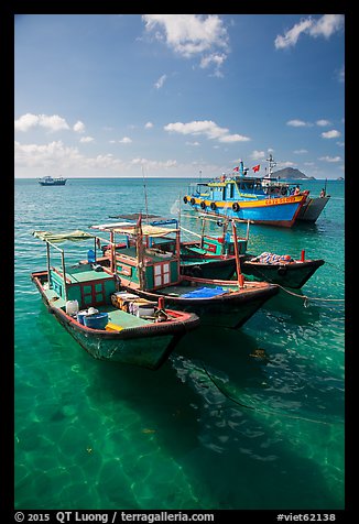 Fishing boats floating on clear water, Con Son. Con Dao Islands, Vietnam (color)