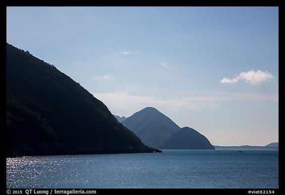 Hills plunging in sea, Bay Canh Island, Con Dao National Park. Con Dao Islands, Vietnam (color)