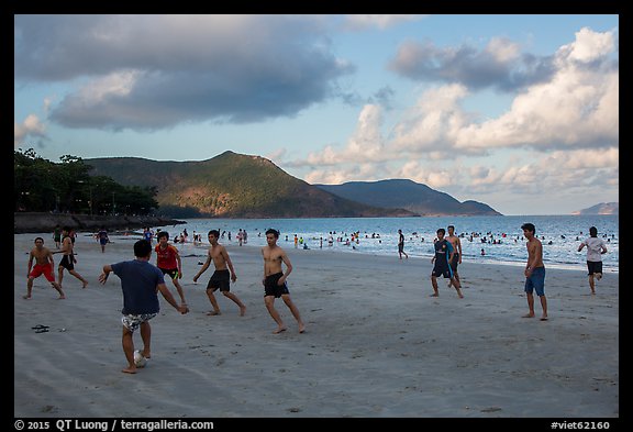 Men play soccer on beach, Con Son. Con Dao Islands, Vietnam (color)