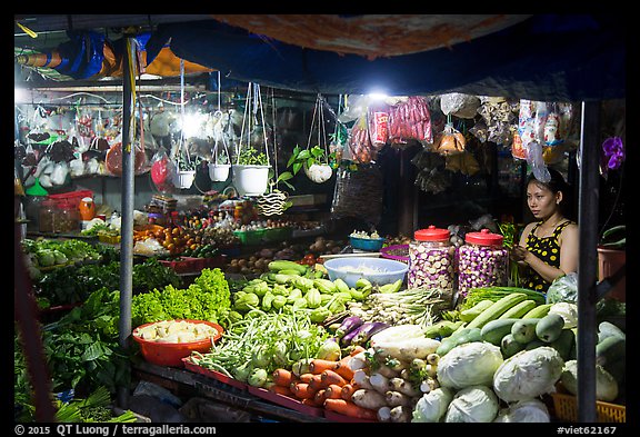 Vegetable seller at night, Con Dao Market, Con Son. Con Dao Islands, Vietnam (color)