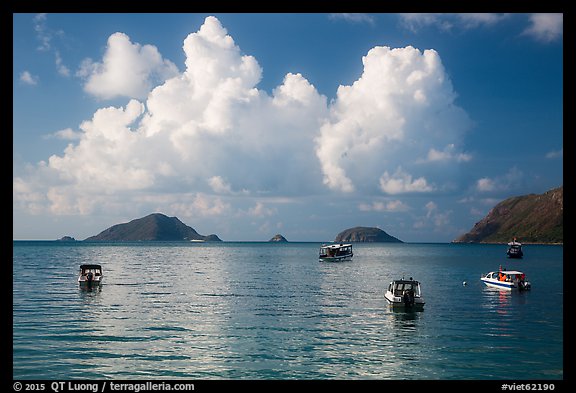 Boats, islets, and clouds, Con Son Bay. Con Dao Islands, Vietnam (color)