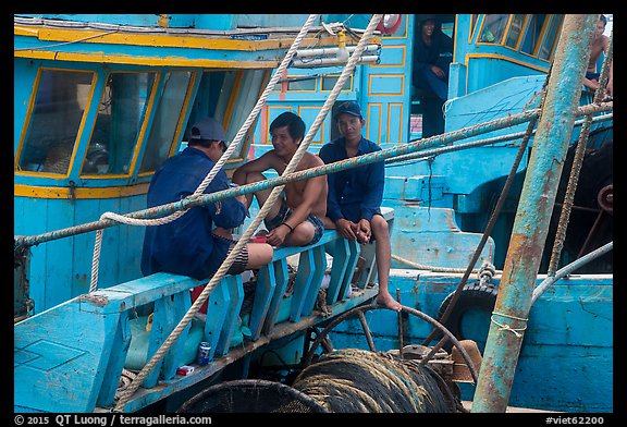 Fishermen relaxing on boats, Ben Dam. Con Dao Islands, Vietnam (color)