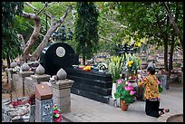 Woman pays respect to Vo Thi Sau grave. Con Dao Islands, Vietnam ( color)